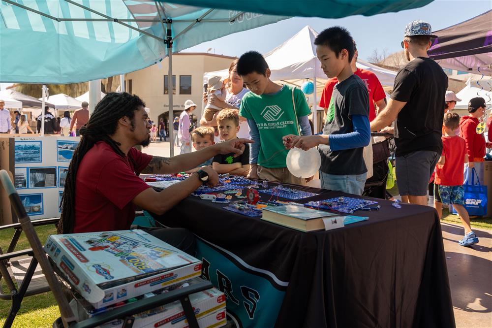 San Marcos Elementary School works on a science experiment with children at Chandler Innovation Fair.